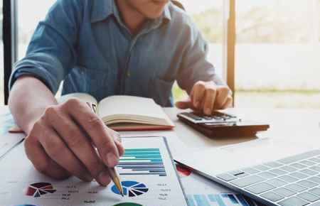 business person working with calculator